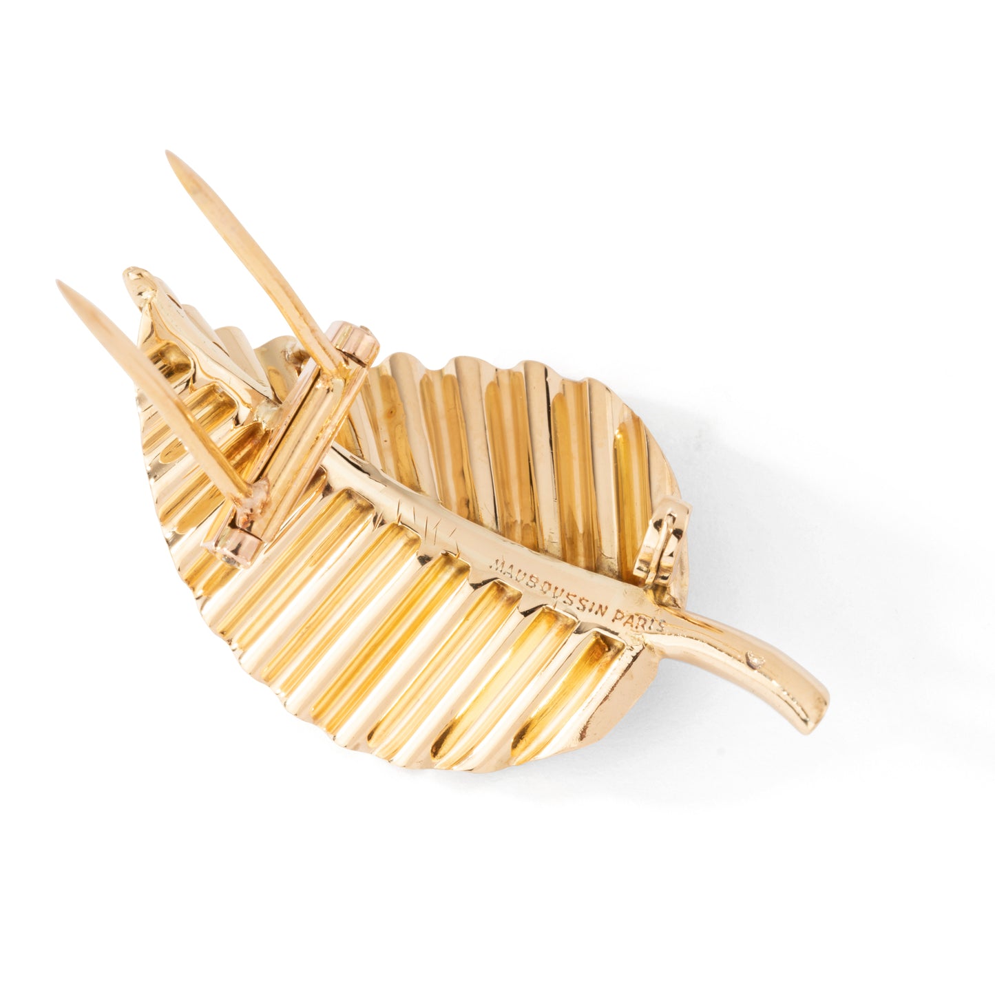 Broche feuille MAUBOUSSIN en or jaune.