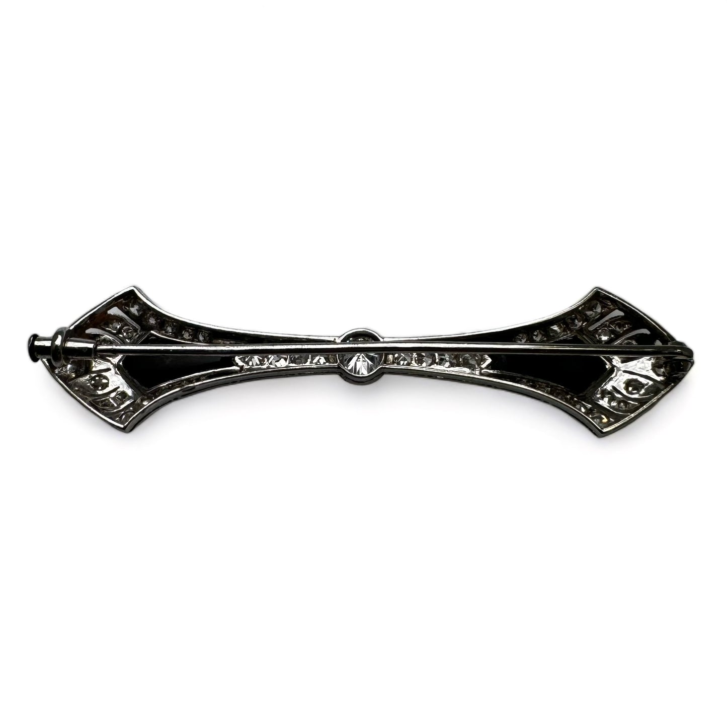 Broche barrette Art-Déco en platine, diamants et onyx.