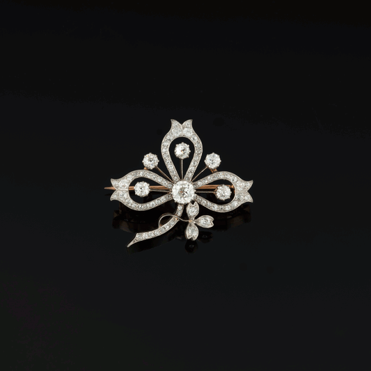 Broche - pendentif trèfle ancienne en or et platine ornée de diamants. Vers 1900