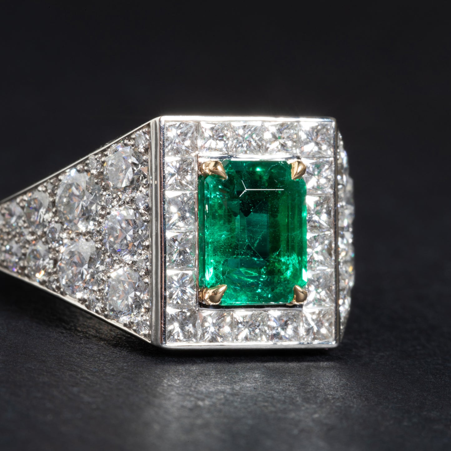 Platinum and yellow gold ring set with an emerald