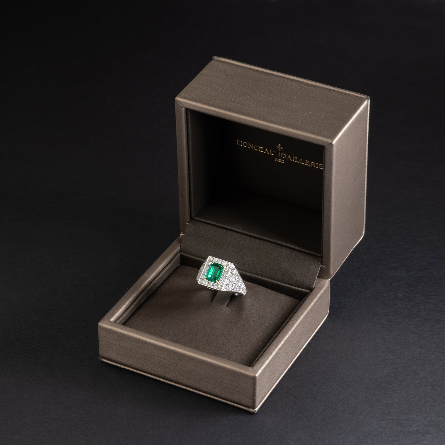 Platinum and yellow gold ring set with an emerald