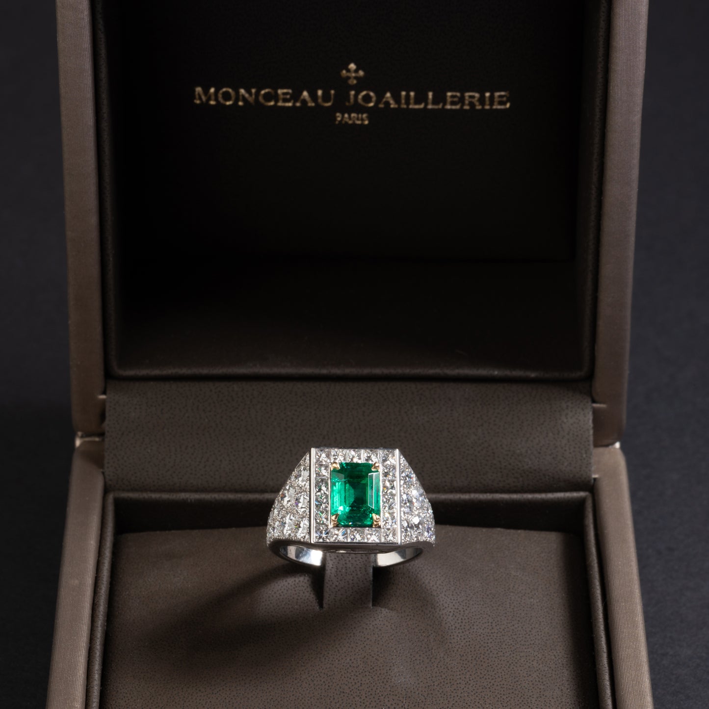 Platinum and yellow gold ring set with an emerald