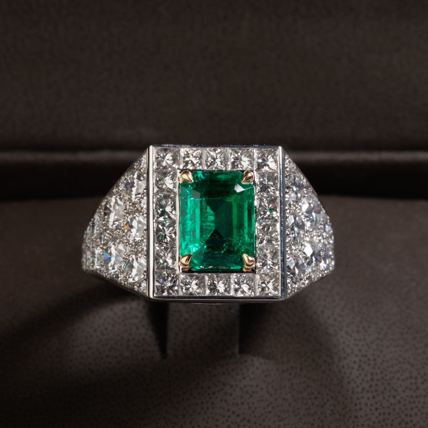 Platinum and yellow gold ring set with an emerald