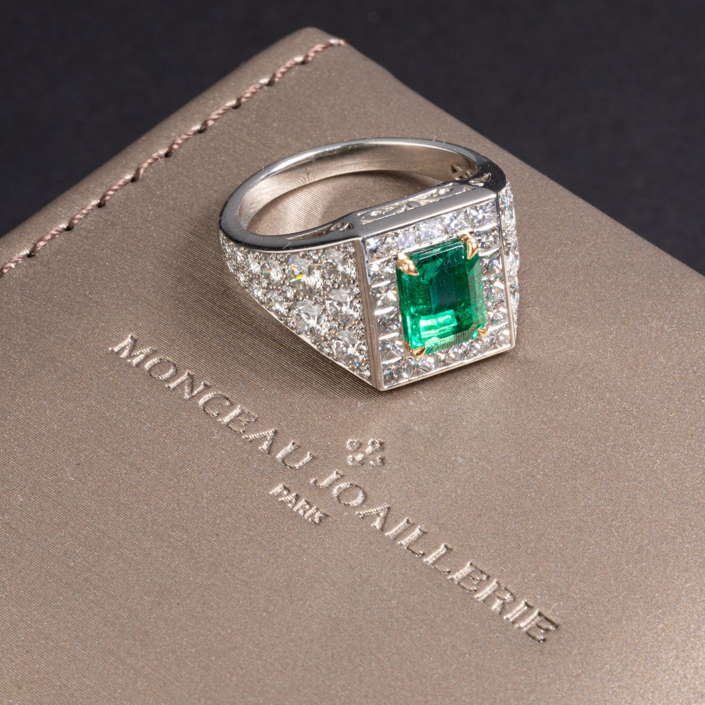 Platinum and yellow gold ring set with an emerald