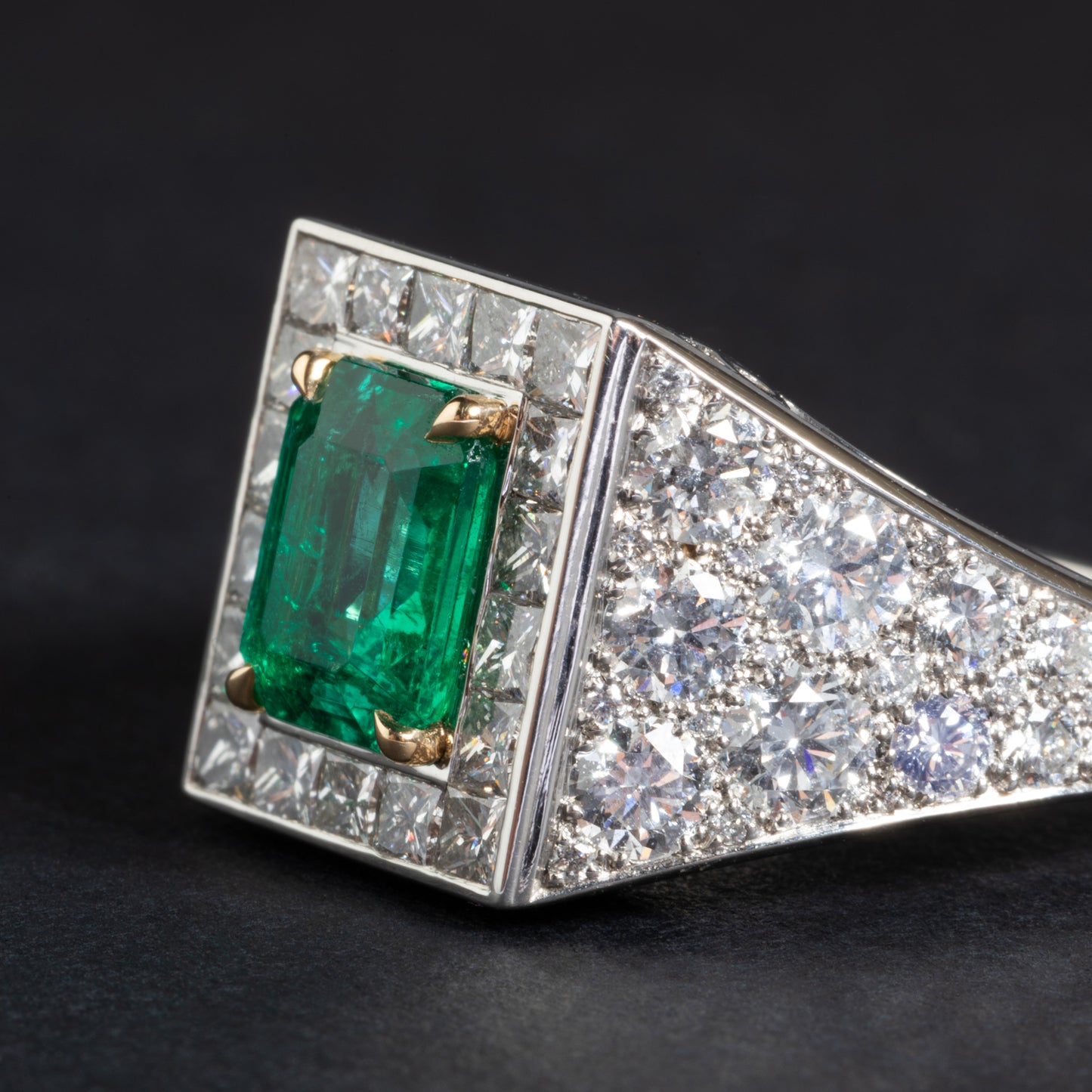 Platinum and yellow gold ring set with an emerald