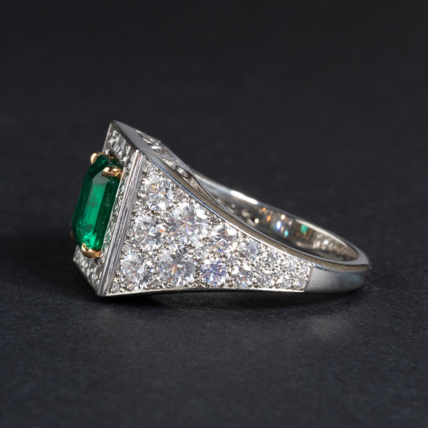 Platinum and yellow gold ring set with an emerald