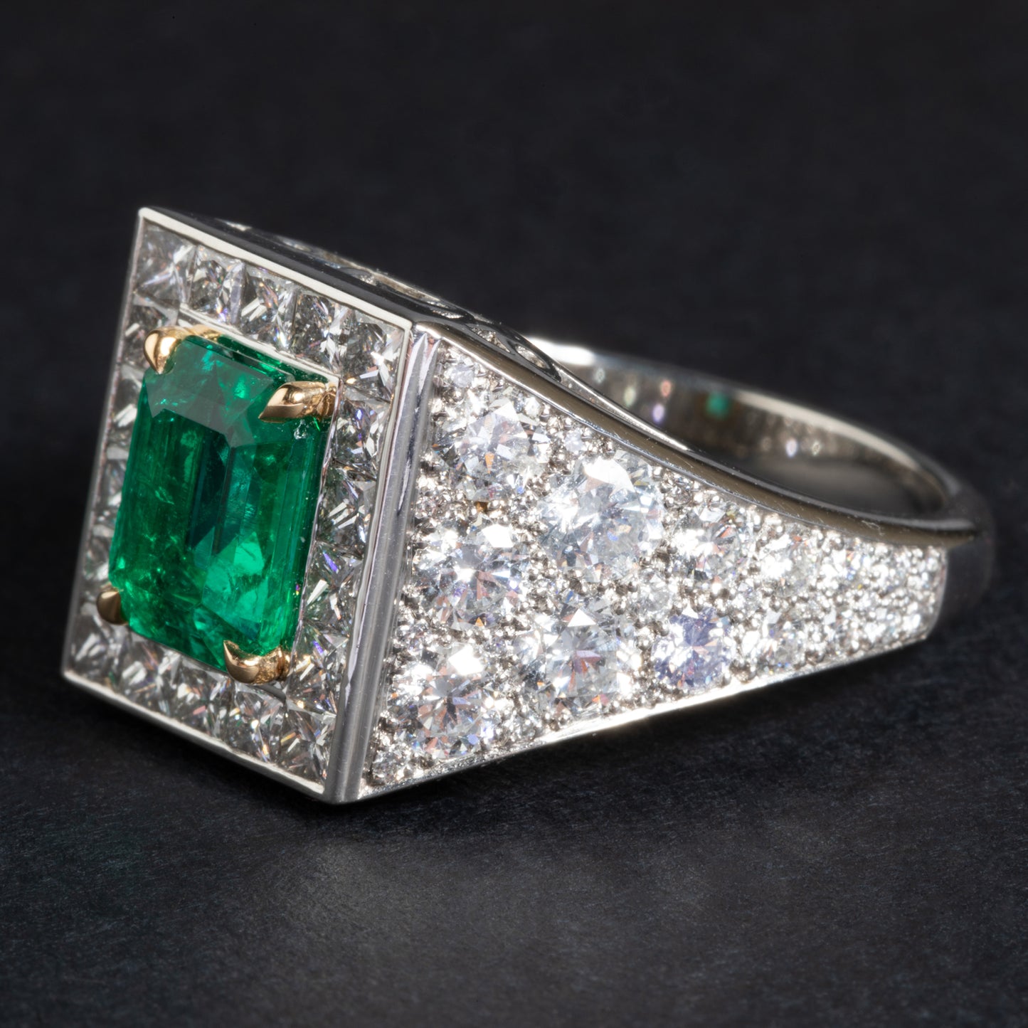 Platinum and yellow gold ring set with an emerald