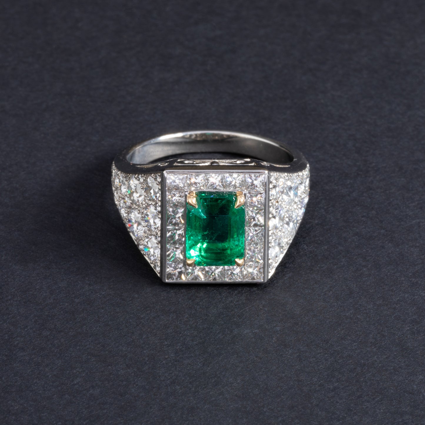 Platinum and yellow gold ring set with an emerald