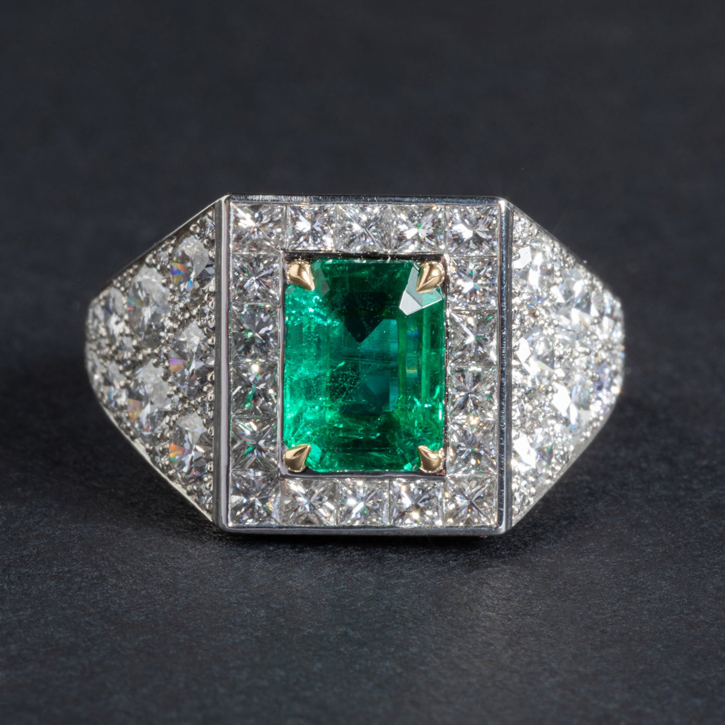 Platinum and yellow gold ring set with an emerald
