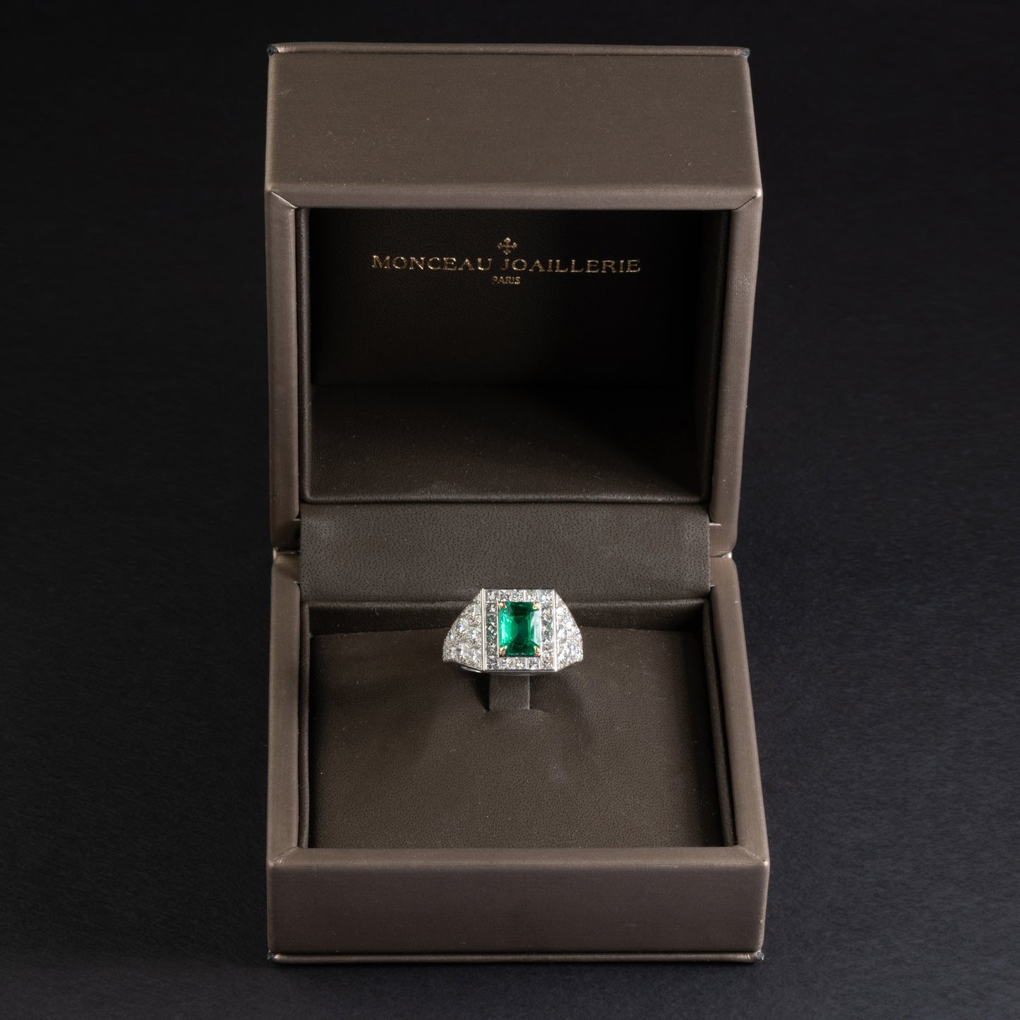 Platinum and yellow gold ring set with an emerald
