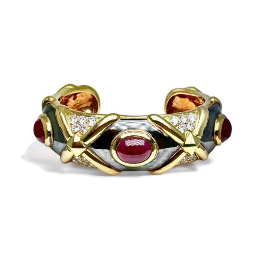 Bracelet vintage jonc en or noirci et jaune orné de rubis et diamants.