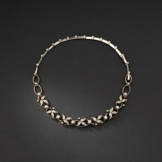 Collier transformable en deux bracelets en or et argent rehaussé de diamants.
