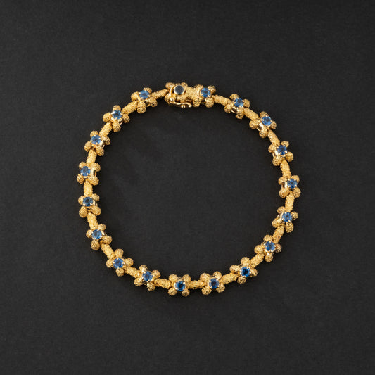 Bracelet souple en or jaune et saphirs. Vintage