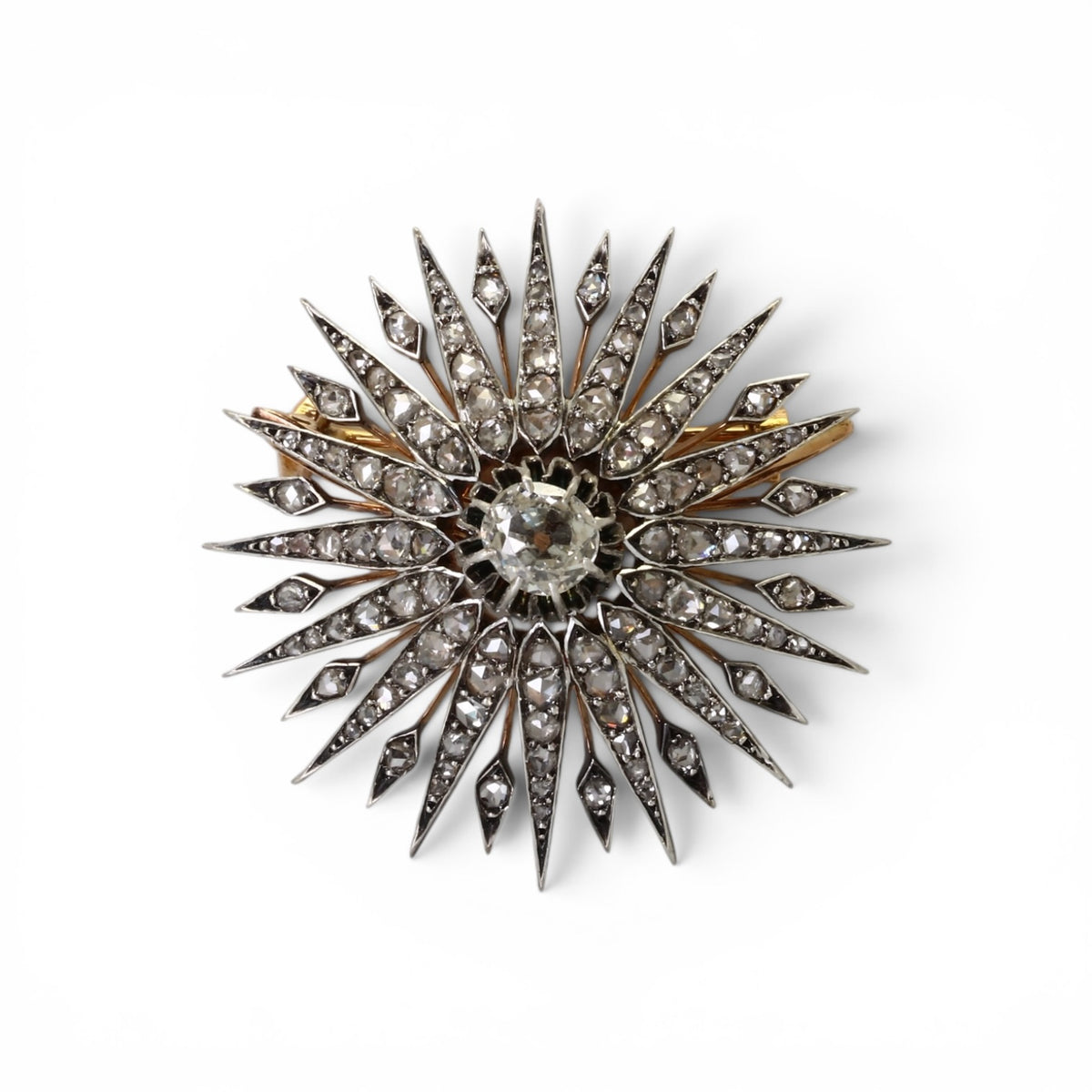 Broche Soleil en or rose, argent sertie de diamants taille rose et ancienne. Vers 1910