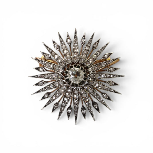 Broche Soleil en or rose, argent sertie de diamants taille rose et ancienne. Vers 1910