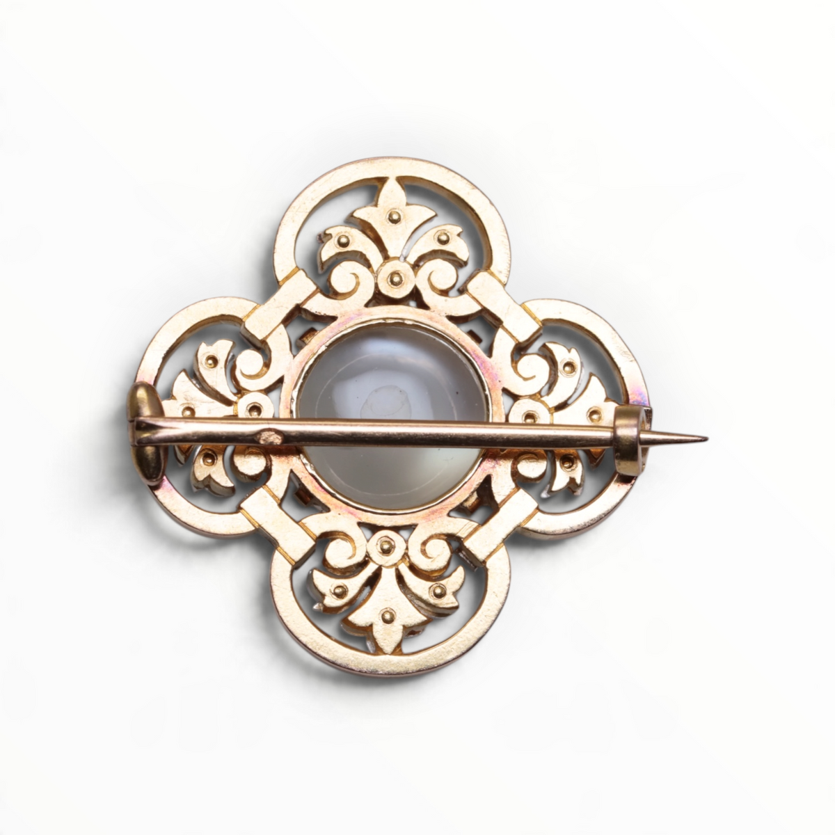Broche en or, pierre de lune, diamants et rubis.