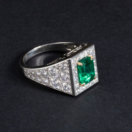 Platinum and yellow gold ring set with an emerald
